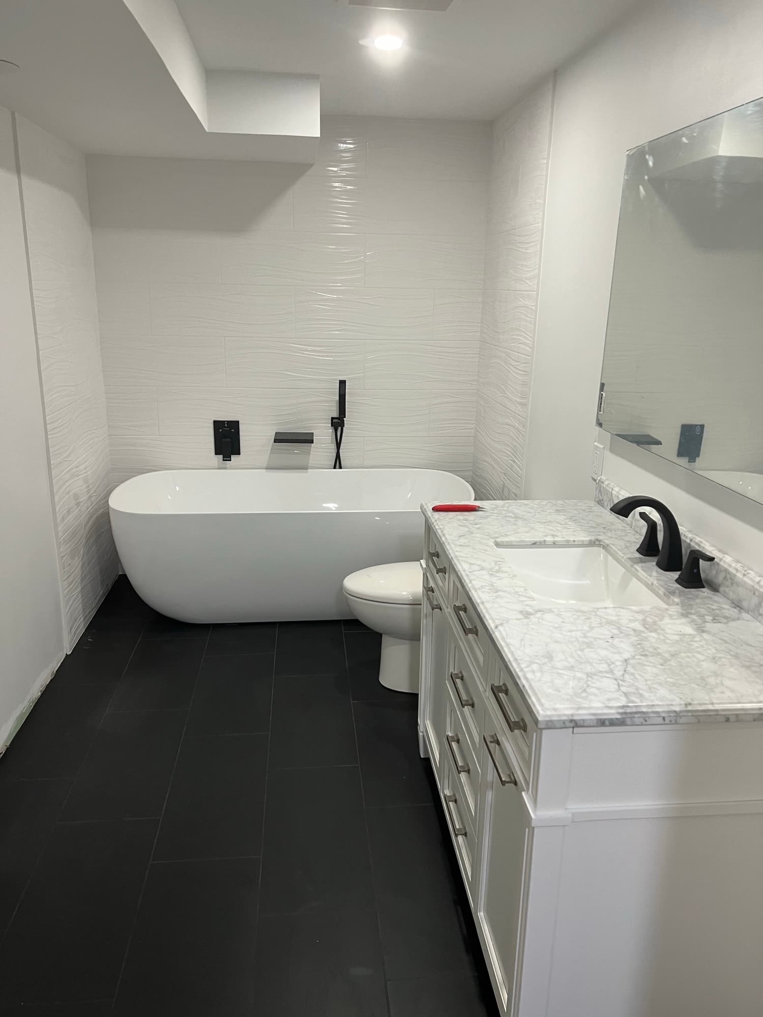 White tile bathroom freestanding tub