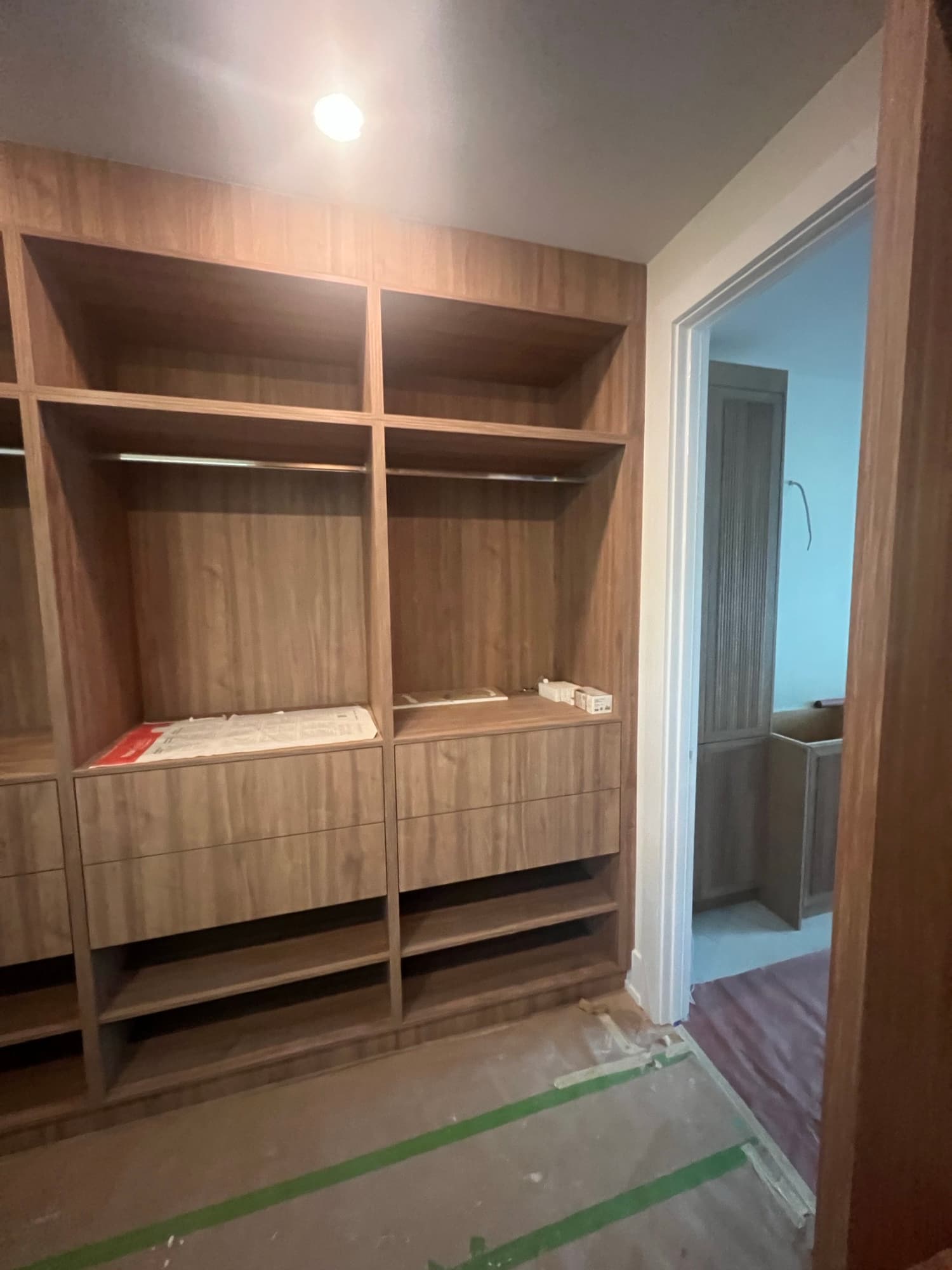 Walnut walk in closet cabinetry