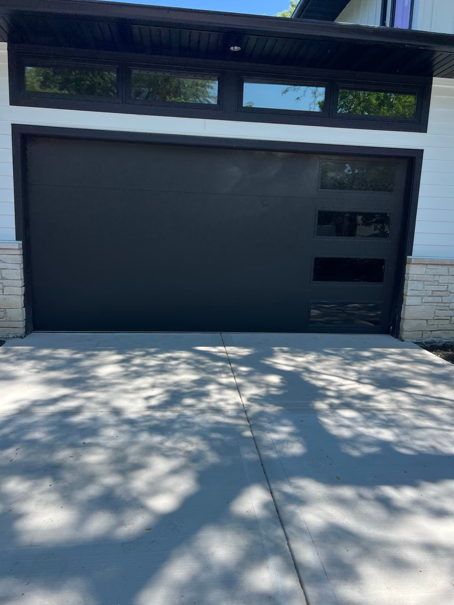 Black modern garage door windows