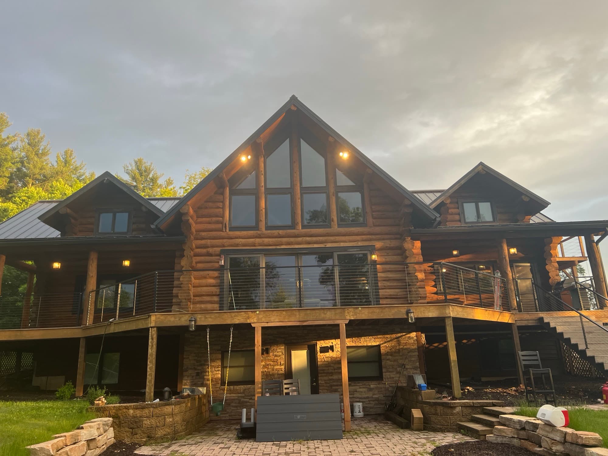 Log home rear deck sunset