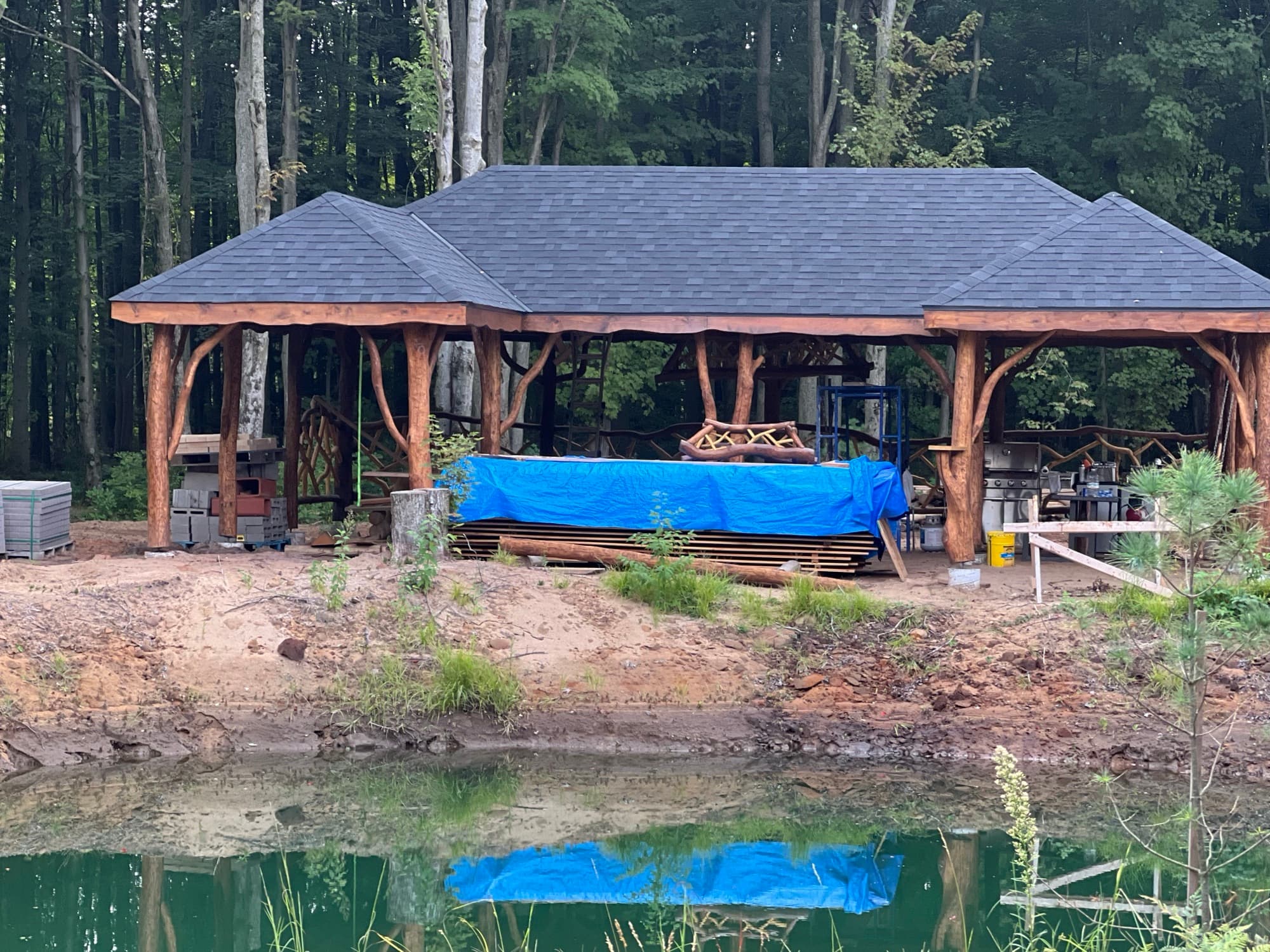 Rustic log pavilion pond