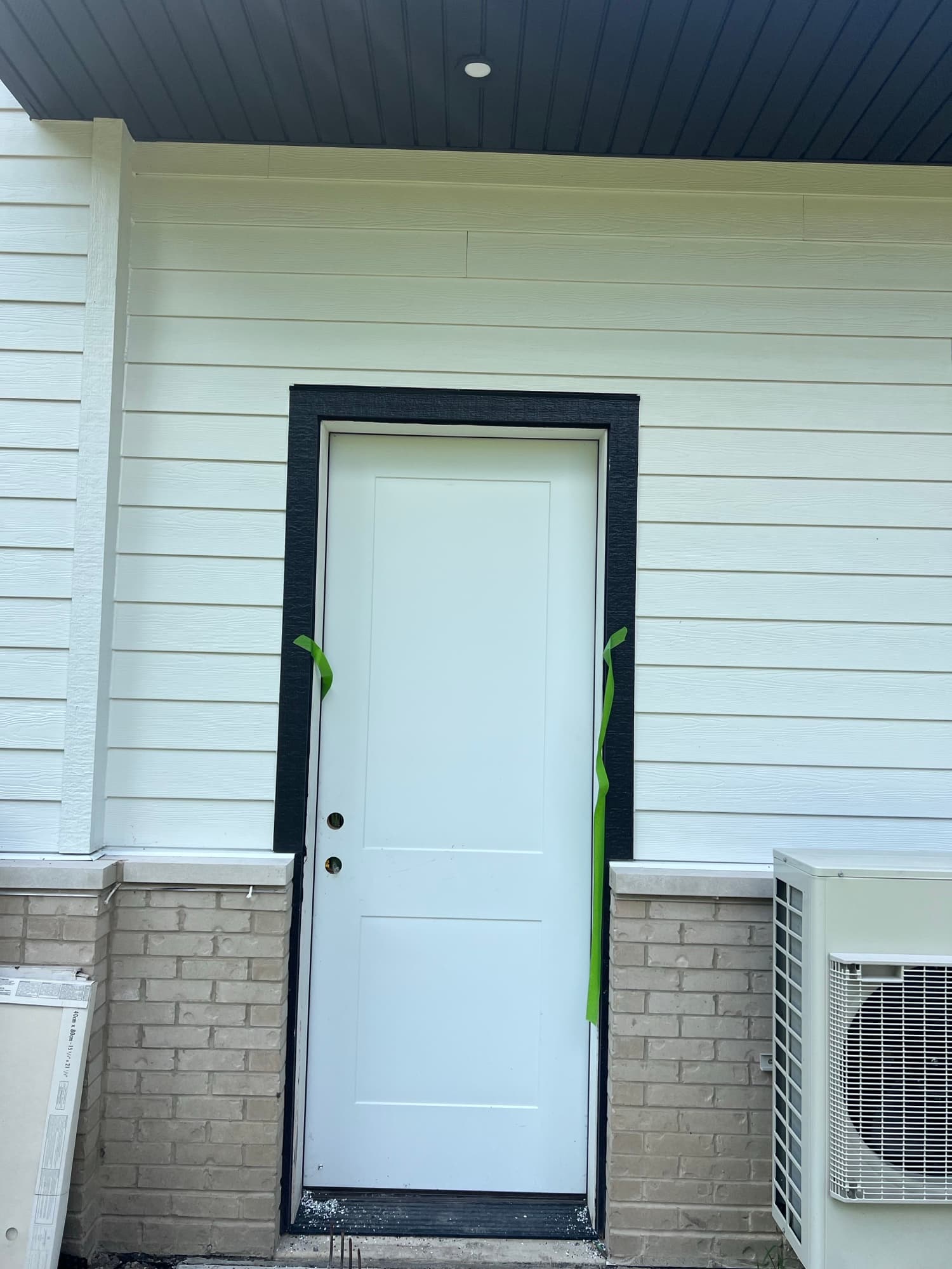 White siding brick wainscot door